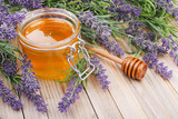 Fototapeta Lawenda - jar of liquid honey with lavender