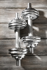 Sticker - Big dumbbells on wooden background