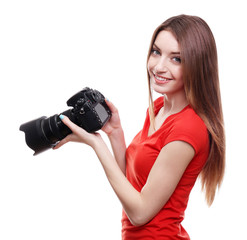 Young female photographer taking photos isolated on white