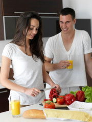 Wall Mural - happy young couple in kicthen