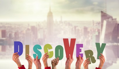 Poster - Composite image of hands holding up discovery