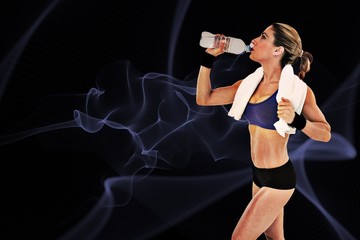 Fototapete - Composite image of strong blonde drinking from water bottle