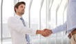 © WavebreakMediaMicro - Composite image of two businessmen shaking hands in office