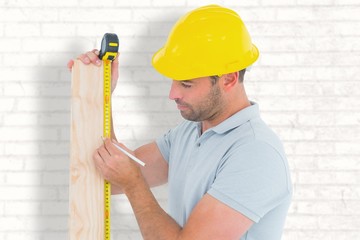Poster - Carpenter using measure tape to mark on woode