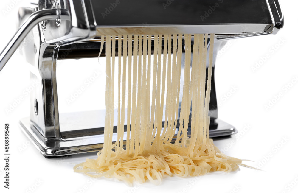 Metal pasta maker machine with dough isolated on white