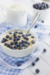 Healthy breakfast with muesli, natural yogurt and fresh blueberr