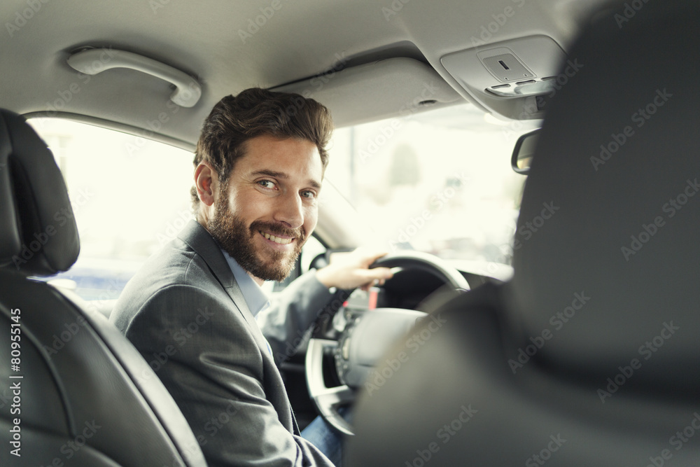 Portrait of man in his car. looking at camera - obrazy, fototapety, plakaty 