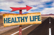 © gustavofrazao - Healthy Life sign with road background