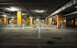 Image of parking garage underground interior, dark industrial bu