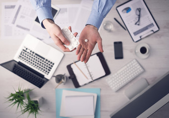 Wall Mural - Office worker taking a pill