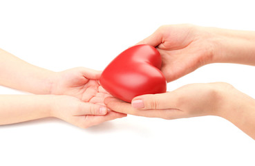 Wall Mural - Heart in child and mother hands isolated on white