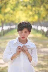 portrait of beautiful young asian woman wearing white shirts sta