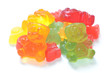 Heap of colored gummy bears isolated on white