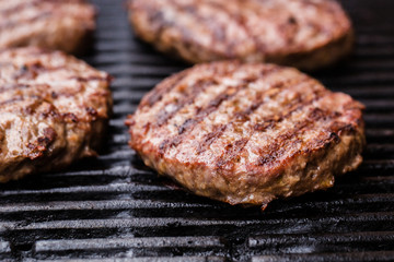 Preparing a batch of  grilled ground beef patties or frikadeller