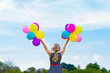 © nyushashypulia27 - girl playing with colorful balloons against the blue sky