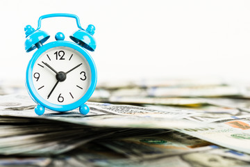 Wall Mural - Time is money. Alarm clock and dollar banknotes.