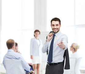 Canvas Print - handsome buisnessman with jacket over shoulder