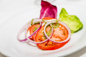 Wall Mural - Sliced Tomatoes with Pesto and Onions