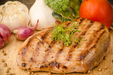 Grilled pork (Pork steak) on wooden plate