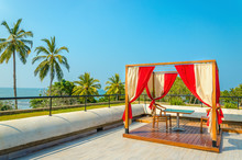 Pergola With Tables And Chairs, Red Curtains On Luxury Hotel