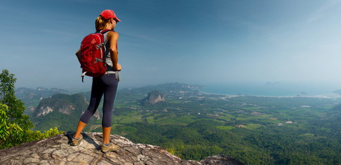 Wall Mural - Lady hiker on the mountain