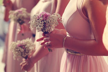 Hands Of Bridesmaid Holding A Beautiful Gypsophila Bouquet