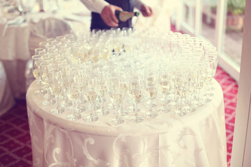 Wall Mural - Many glasses of champagne on table