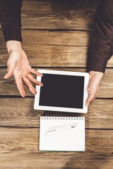 Wall Mural - Pad. Man shows screen of digital tablet in his hands. Clipping