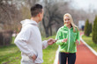 © bokan - Young woman exercising with her coach