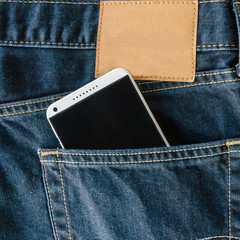 blue denim Jeans pocket with mobile phone.