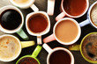 © Africa Studio - Many cups of coffee on wooden table, top view