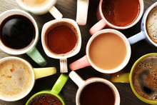 Many Cups Of Coffee On Wooden Table, Top View