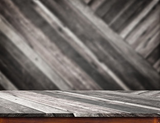 Poster - Empty wood table top with blur diagonal wood wall.
