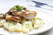 pikeperch on butter with mushroom sauce and spring potatoes