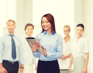 Sticker - smiling woman looking at tablet pc at office