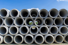Concrete Drainage Pipes Stacked At Construction Site Backgroundv