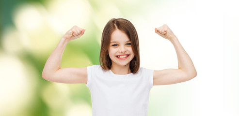 Wall Mural - smiling little girl in white blank t-shirt