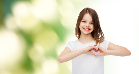 Canvas Print - smiling little girl in white blank t-shirt