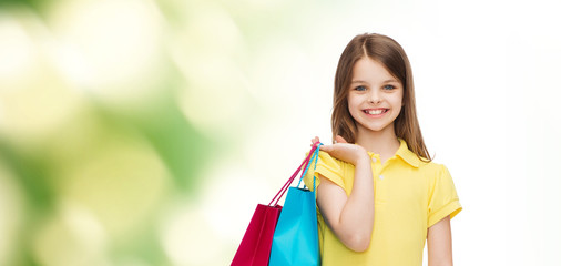 Sticker - smiling little girl in dress with shopping bags