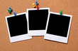 Several three group polaroid style photo frame print pinned to a cork notice board background 