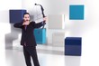 © WavebreakMediaMicro - Composite image of focused businessman shooting a bow and arrow