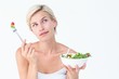 © WavebreakmediaMicro - Thoughtful blonde eating salad