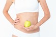 © WavebreakmediaMicro - Woman holding an apple in front of her belly