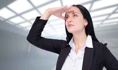 Poster - Composite image of pretty businesswoman looking with hand up