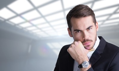 Wall Mural - Composite image of cheerful businessman posing with hand on chin