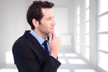 Poster - Composite image of thinking businessman touching his chin