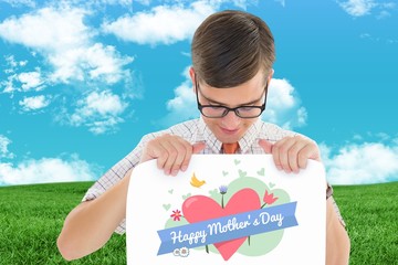 Poster - Composite image of geeky hipster smiling and showing card