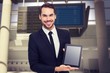 © WavebreakMediaMicro - Composite image of smiling businessman showing his tablet pc