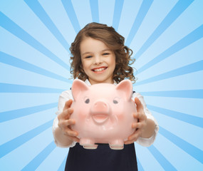 Poster - happy girl holding piggy bank