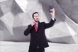 © WavebreakMediaMicro - holding calculator while talking on phone